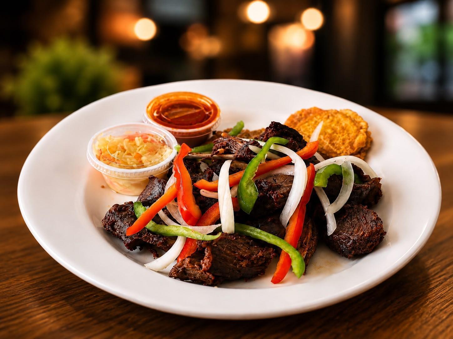Griot pork platter at Seven Wonders
